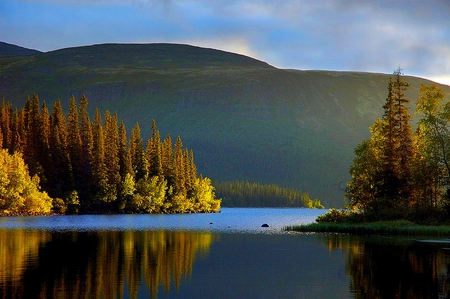 KOLA PENINSULA LAKE,RUSSIA - calm, trees, hills, blue, cliff, lake