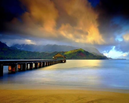 LIGHT AT THE END OF THE PIER - dock, ocean, sky, hill, plants, clouds, light, trees, sunshine, green