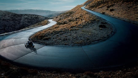 biker on the mountain road - photography, abstract