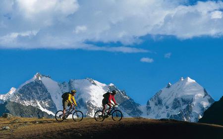 A breath of fresh air - bikes, biking, people, bicycles, snow, mountains, switzerland, cycling