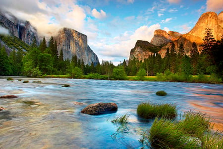 Flowing River Between Mountains - paradise, grasslands, great, mesa, lagoons, white, lakes, amazing, paysage, grass, pond, trunks, between, mounts, peaks, scenario, nature, yosemite, flowing, beautiful, mirror, photoshop, leaves, stones, pines, nice, sky, valley, trees, photography, water, mountains, coll, leaf, brown, clouds, orange, green, rivers, scene, landscapes, rapids, morning, paisagem, national parks, flow, paisage, plants, blue, scenery, awesome, photo, gray