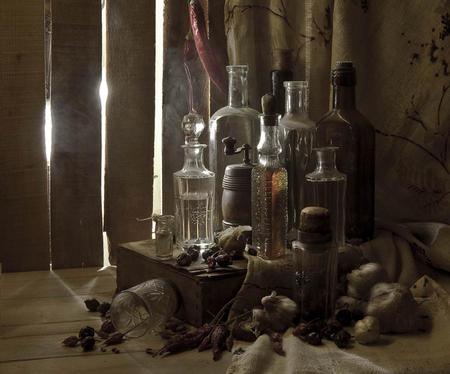 STILL LIFE - linen flower curtain, dried berries, old box, assortment of pretty bottles, glass