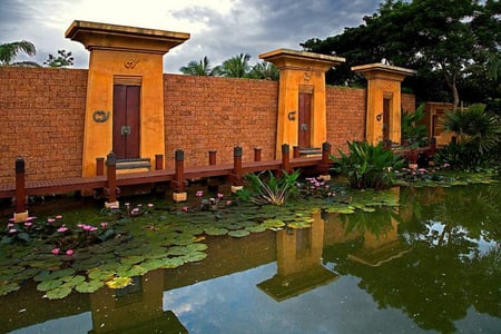 Thai Lily Pond - fence, lilypond, lilypads, thailand, wall, doors, flowers