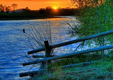 Fence on the River - scenery, rivers, brown, sunlights, scene, frontier, scenario, land, plants, nice, sunrises, pond, gold, colors, fence, natural, grasslands, nature, gray, green, ondulations, waterscape, reflections, blue, amazing, landscape, grass, photo, sunsets, creeks, leaves, wawes, forests, mirror, golden, sky, sun, clouds, trees, water, beautiful, photography, photoshop, reflected, cool, orange, black, colorful, awesome, panorama, leaf