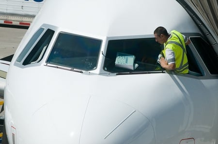 He reading manual how to clean window - airplane, aircraft, jet, manual, joke