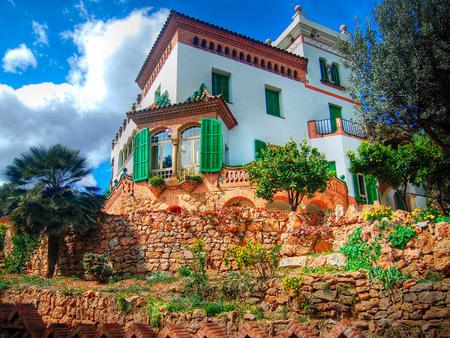 Rock garden home - trees, brick, home, white, rugged, plants, green shutters, wall, rocks