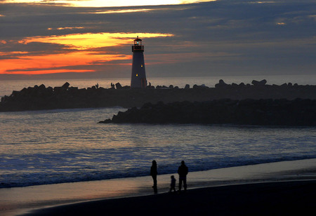 lighthouses ligthing the nigth - trees, sunset, water, beach, sea, sky