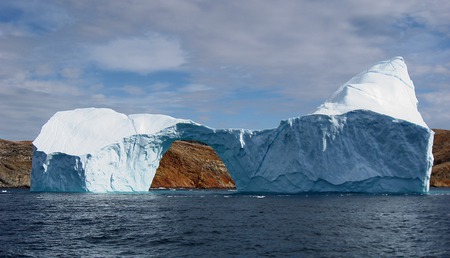 Iceberg with hole - nature, ocean, iceberg, calving, coast