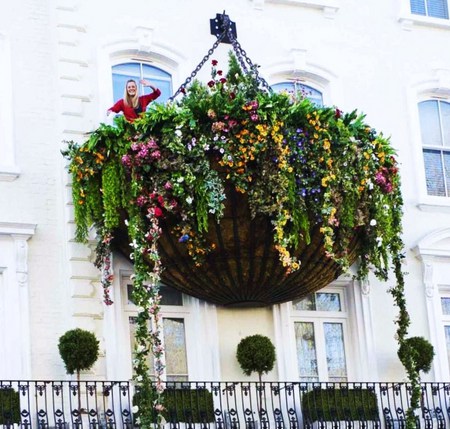 The extreme in hanging baskets - balcony window, house, flowers, basket, colors, vines