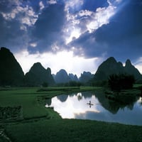 mirror reflection of sky and hills