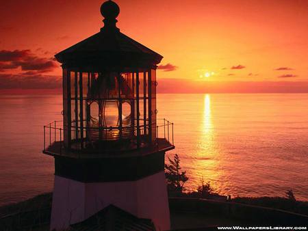 Lighthouse at sunset - building, lighthouse, ocean, sunset