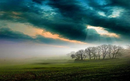 FIELD DOWN THE HILL - sunbeams, misty, grass, sky, foggy, morning, clouds, sunlight, field, trees