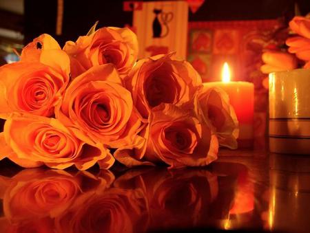 A night for love - romance, orange lighting, roses, candles