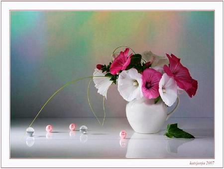 A simple bit of nature - white and pink flowers, vase, marbles, leaves