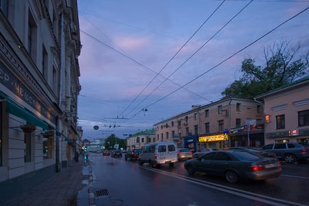 town-europe - tree-background, open sky, cars, town, eastern europe, powerlines, multi-story buildings, overhead trolly-line, street, sidewalk, dusk, russian federation