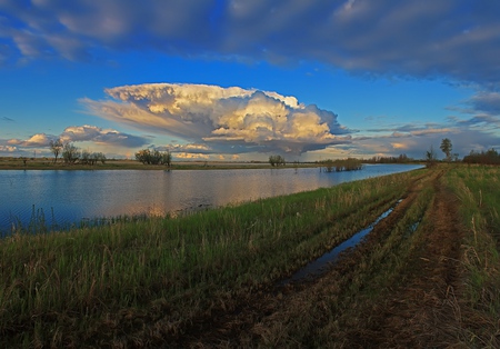 river-cloudy day - low marsh, day, dirttrack, cloudy, river, muddy, sandbar, distant trees, obscured sun