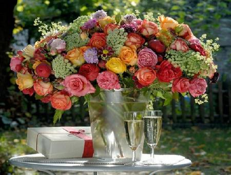 Gorgeous centerpiece - vase, roses, present, table, colors, still life, flowers, wine, wineglass, rainbow, gorgeous, grand, ribbon, bucket, bubbly, bow