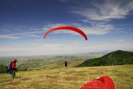 Be Free - people, landscape, skydiving, grass, sport, view, paragliding, houses, sky, clouds, trees, beautiful, romania, parachute, tree, village, nature, mountains