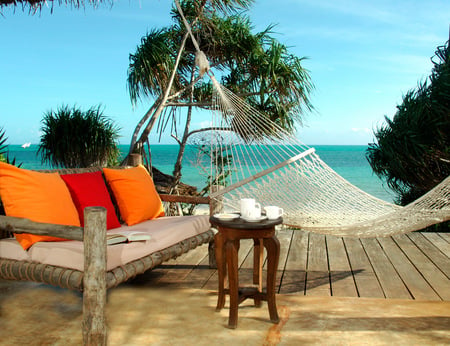 Vacation Getaway - coffee, hammock, couch, table, deck, ocean