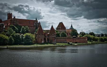 Castle in Malbork - castle, river, architecture, towers, medieval