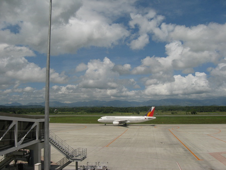 Airplane at the landing ban. - plane, clouds, white, blue, airport