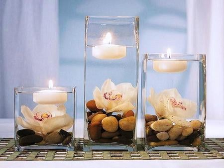 Lilies and floating candles - floating candles, white, lilies, blue, rocks, three