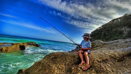 solitary boy - clouds, water, blue, fishing, wet, ocean, child, boy, sport, nature