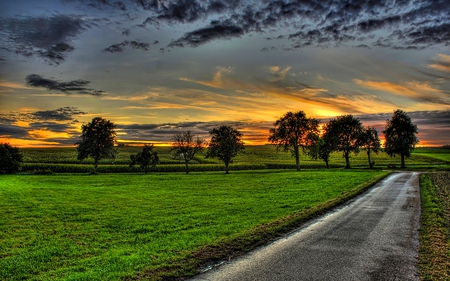 AFTER THE STORM - clouds, trees, sunsets, dark, countryside, straight road, field, pathway, sky