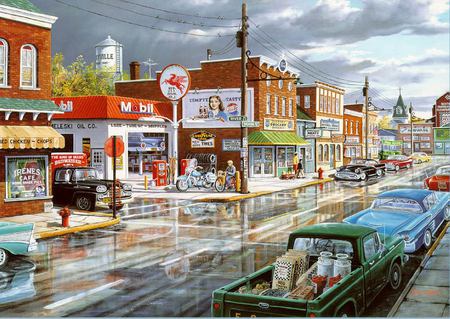 Refections on main street - truck, town, gas, rain