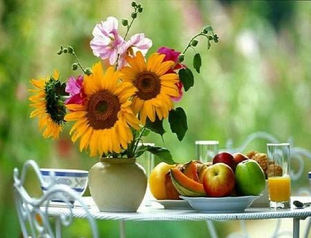 Take a break - melons, flowers, vase, sunflowers, apples, patio table, fruit bowl, pink flowers