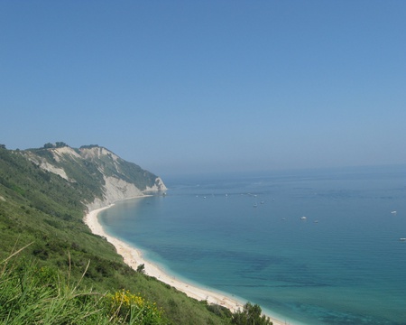 Stunning Coastline - ocean, beach, sky, boats, cliff, water, torquoise, white, blue, green, house, shrubs, sand