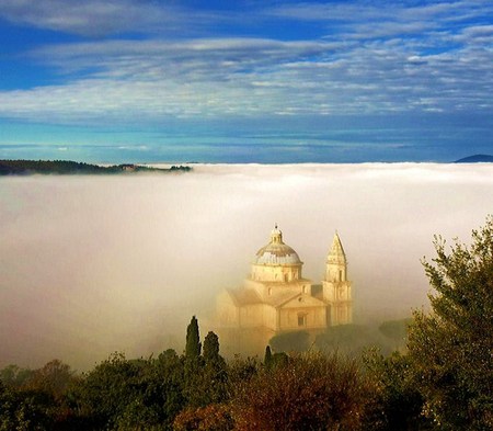 St Blaise church in Italy - fog, tree tops, mist, blue sky, italy, saint blaise church