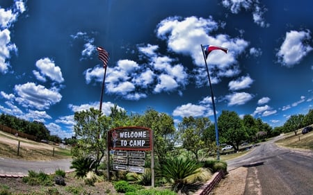 Welcome To Camp - sky, trees, peaceful, camp, colorful, road, welcome, nature, view, flag, clouds, blue, beautiful, colors, flags