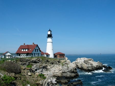 Portland Head Lighthouse - vegetation, house, water, lighthouse, blue, rock, sea, ocean