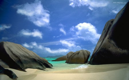 Paradise Beach - clouds, water, blue, beautiful, rock, unspoiled, nature, green, sky, formations