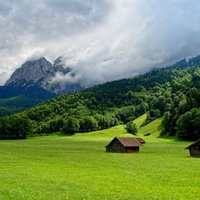 HOUSES AT THE FOOT OF THE MOUNTAIN