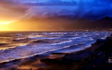 Sunset's Storm - ocean, beach, water, sunset, buildings, waves, storm clouds, clouds, sea