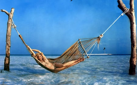 Laetitia Casta - water, blue, hammock, sea, island, french, sand, actress, crystal clear, bikini, model