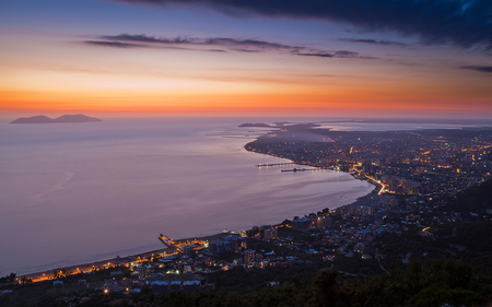 Twilight in Vlora - lights, sky, coast, clouds, piers, city, sunset, colors, twilight