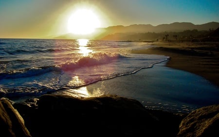 Sunset in Maui - beach, sky, ocean, surf, lifeguard, palms, mountains, sunset, clear, rocks, calm, towers