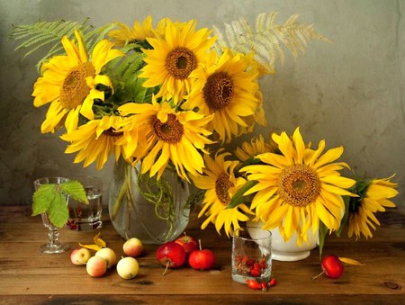 Flowers of the sun - yellow and brown, sunflowers, water, leaves, table, vase