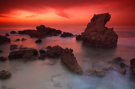 The Last Sunset - water, sunset, rocks, red