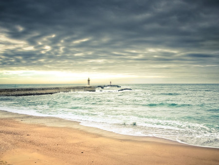 amazing Beach - fun, sky, beach, peaceful, water, clear, white, amazing, dark, tan, clouds, sunny, sand, ocean, sunlight, light, wet, foam, nature, relaxing, cloudy, blue, beautiful