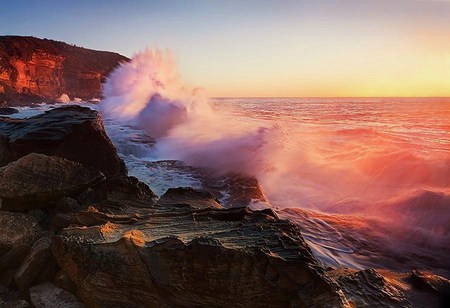 Sunset waves - spray, sunset, pink hue, crashing waves, cliffs, rocks