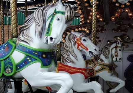 Ride into the past - brass poles, painted horses, horses, red, green, lights, carousel