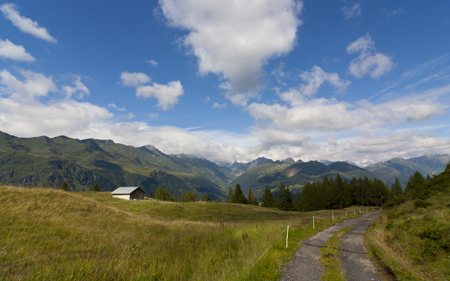 Alpine Hut - hut, valley, sky, forests, mountains, capped, road, nature, rural, blue, snow, beautiful, clouds