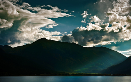 Sunbeam in the Rockies - sky, lake, forests, mountains, nature, dark, clouds, blue, beautiful