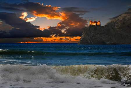 sunset - blue, amazing, beach, landscape, sunrise, sunsets, medieval, view, color, golden, nice, sky, sun, castle, clouds, house, sunlight, water, beautiful, photography, rock, sea, colors, cool, architecture, ocean, nature, sunset, waves, rocks