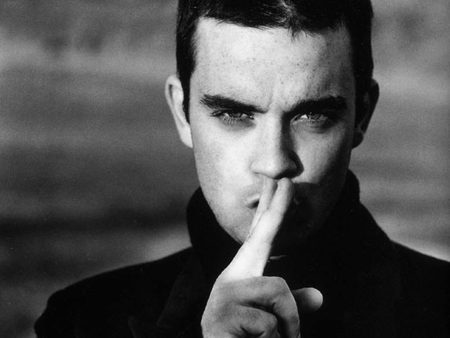 Robbie Williams - male, black sweters, pretty, hand, eyes, singer