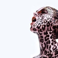 woman-with-leopard-spots-tattoos-on-face